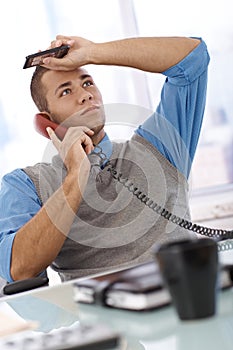 Troubled businessman on call