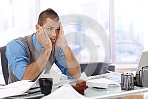 Troubled businessman at desk