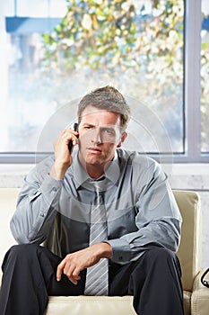 Troubled businessman on phonecall