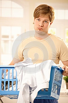 Troubled guy at housework photo