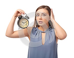 Troubled woman with alarm clock on white background. Time management concept