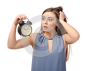 Troubled woman with alarm clock on white background. Time management concept