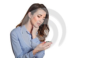 Troubled woman reading bad news on phone touching her head in mi