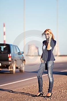 Young fashion business woman calling on cell phone outdoor