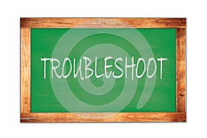 TROUBLESHOOT text written on green school board