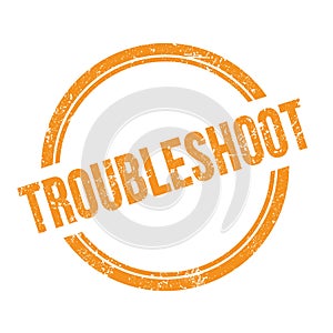 TROUBLESHOOT text written on orange grungy round stamp