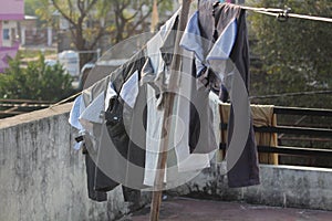 Trouser cloths hanged on rope in india