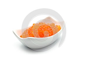 trout eggs in a white ceramic bowl on white background