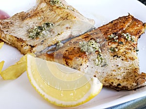 Trout fillet with marinade on a plate