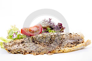 Trout fillet with tomato and salad