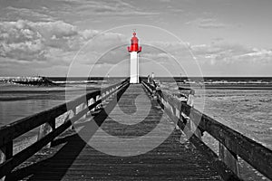 Trouville lighthouse, red selective color, Normandy France