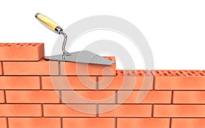 Trowel and bricks wall construction photo