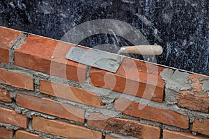 Trowel on a clay bricks