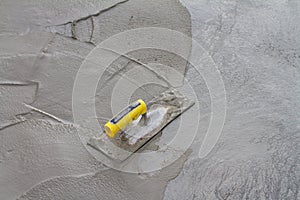 Trowel on fresh concrete on construction site