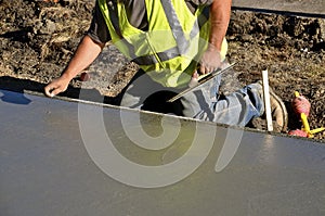 Troweling wet concrete