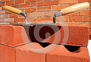 Trowels, bricks and mortar.