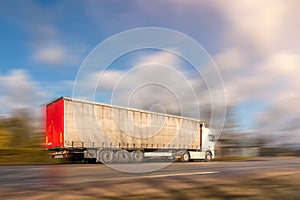 Truck on asphalt road motion blur