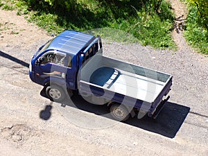 Truck with body for cargo transportation.