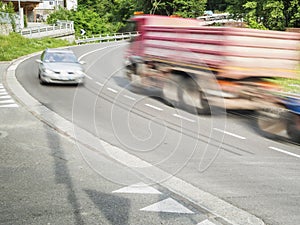 Truck and car in the curve