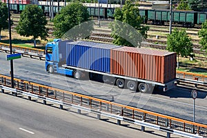 Truck with containers in seaport, cargo shipping and transportation concept