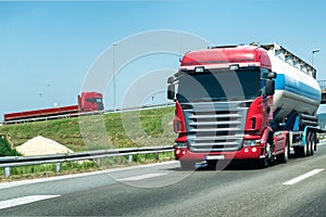 Truck on country highway under blue sky