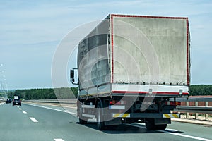Truck on country highway under blue sky