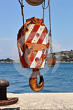 Truck crane hook on the background of the sea.