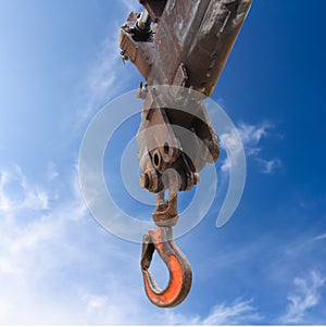 Truck crane hook on blue sky