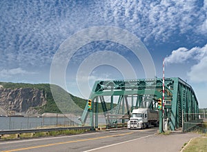 Truck crossing iron bridge