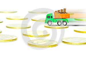 Truck deliver and gold coins isolated on white background,investment or speedy cash concept