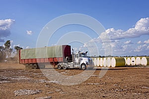 Truck delivering cotton bales