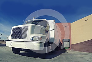 Truck delivering at warehouse