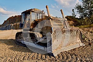 truck digging ground for construction excavator gravel sand trees blue sky