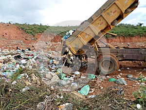 Truck discharging solid waste garbage