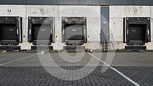 Truck dock platform logistics warehouse empty space door for loading and unloading goods moving sideways