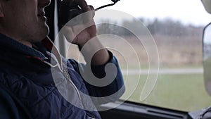 A truck driver asks the traffic situation of other drivers on the walkie-talkie in the cab. The concept of communication