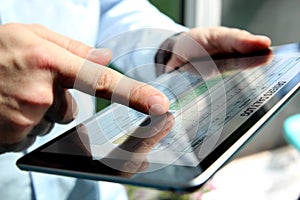 Truck driver checking electronic logbooks on a tablet