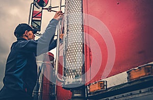 Truck Driver Getting Into Truck