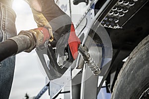 Truck Driver Hold Fuel Pump Nozzle in His Hand