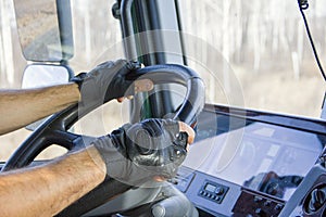 Truck driver keeps driving wheel with both hands