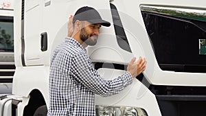 Truck driver loving his job. Trucker hugging his truck vehicle for transportation