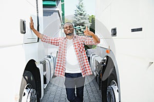 Truck Driver man African American muscular smiling, in long-time business transportation and delivery