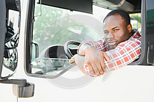 Truck Driver man African American muscular smiling, in long-time business transportation and delivery