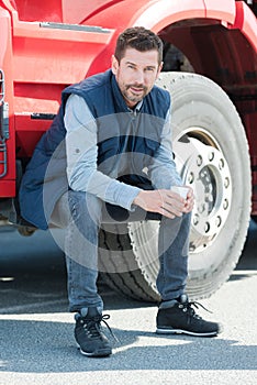 truck driver sitting on steps cab