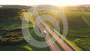 Truck Driver Transport Cargo In Tank On Highway At Sunset Background Aerial View