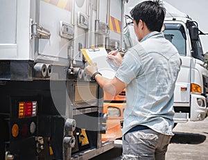 Truck Drivers Holding A Clipboard Checking Container Shipping. Freight Truck Transport Logistics.