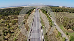 Truck driving along empty freeway in Russia. Aerial drone view.