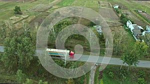 the truck is driving on a country road