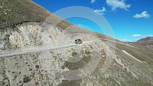 Truck driving on dirt road near mountain, Silverton Colorado