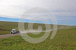 Truck driving on endless Dalton Highway, leading from Fairbanks to Prudhoe Bay, Alaska, USA